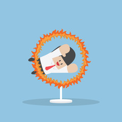 Businessman jumping through the fire hoop © Jiw Ingka