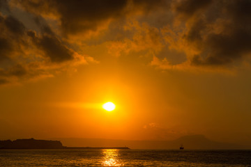 A beautiful beach on a Greek island in summer, under warm evening light