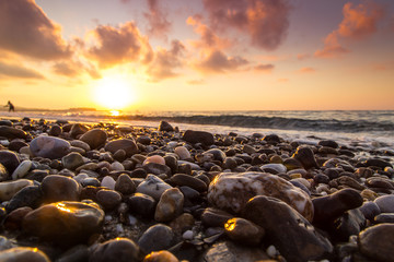 A beautiful beach on a Greek island in summer, under warm evening light