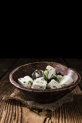Feta Cheese (Marinated) on wooden backround