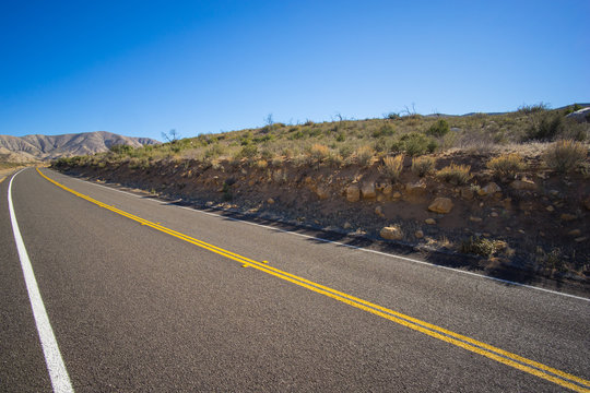 Desert Road in Cut Hillside
