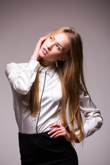 Portrait of happy smiling showing woman  , against grey background