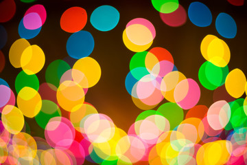 Abstract festive background with bokeh defocused lights