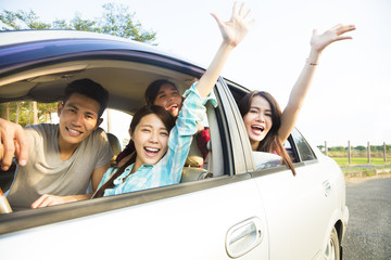 happy young group having fun in the car