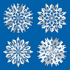 Christmas snowflake icon set. Paper origami cut out sign with shadow. Winter, New Year, childhood, nostalgia, symbol. White 3d silhouette on blue background. Vector isolated