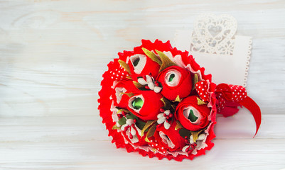 Decorative bouquet of flower red color and a card for text.