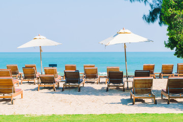 Umbrella pool and chair on the beach