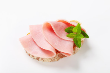 Slice of bread with ham