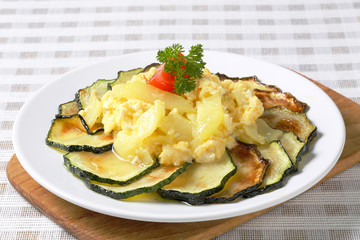 Roasted zucchini with potato egg scramble