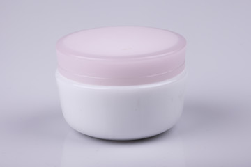 jar of cream on white background