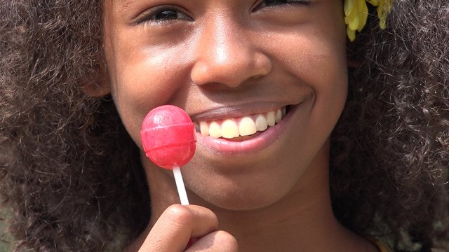 Teen African Girl with Lollipop