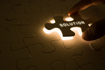 closeup puzzle with solution concept of business