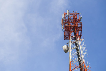 Telecommunication mast TV antennas with blue sky
