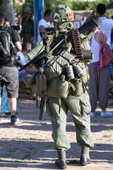 american military with a backpack / soldier carrying a backpack with combat equipment
