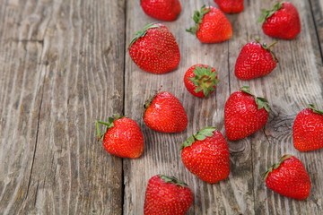 Ripe strawberry on an old wooden table