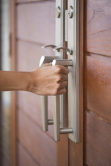 hand hold handle of wood door