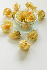Physalis, tomatillo. Edible fruit, ornamental plant. On white or black background and in a glass bowl. 