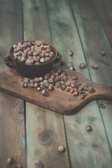 Obraz na płótnie Canvas Hazelnuts in a bowl on rustic background