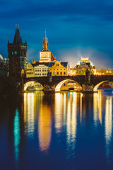 Night scene with Charles Bridge and old water tower in Prague, C