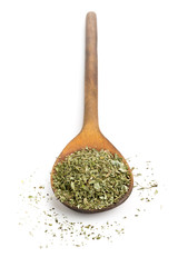 Dried oregano on wooden spoon