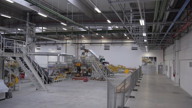 Flying over the production line in modern factory.
