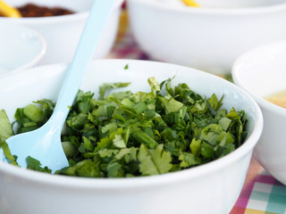 Celery Coriander Cilantro Green Onion sliced mixed in the white cup