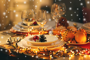 Christmas table setting with holiday decorations