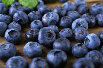 Fresh blueberries on wooden table, closeup