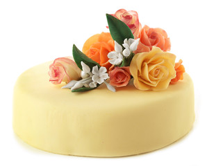Cake with sugar paste flowers, isolated on white