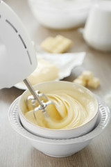 Cooking buttery cream on kitchen