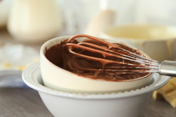 Cooking chocolate cream on kitchen