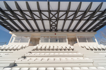 empty tribunes on a soccer (football) stadium