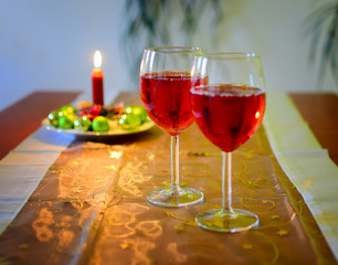 Wine glasses with red wine and christmas decoration