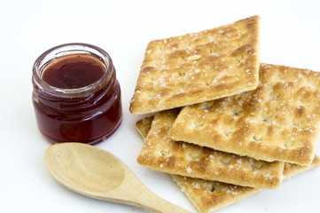 cracker with bottle of jam