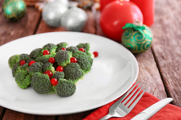 Fototapeta na wymiar Christmas fir tree made from broccoli, on plate, close up