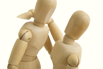wooden figure hug man and woman concept