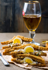 sandwich with a herring and eggs