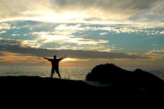 Silhouette Of A Man Admiring The Sunset