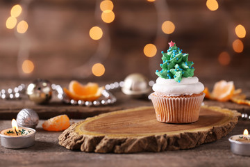 Christmas cupcake on wooden stand