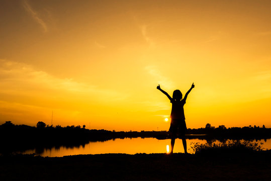 The Winner girl stand alone with sunset background