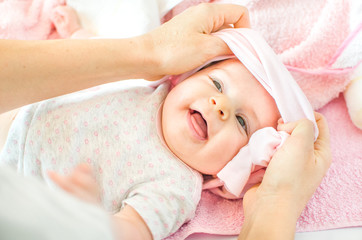 Fototapeta na wymiar dressing newborn baby pink