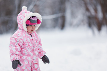 Portrait of beautiful little girl in winter hat