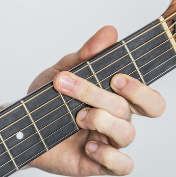 detail of fingers and hand of guitar player
