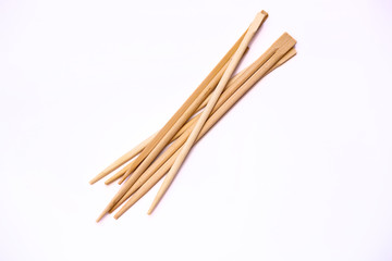 Wooden chopsticks on a white background.