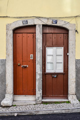 Obraz na płótnie Canvas Two wood doors in the same building