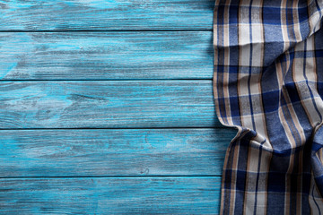 Napkin on blue wooden table, close up