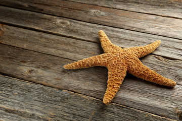 Starfish on a grey wooden table