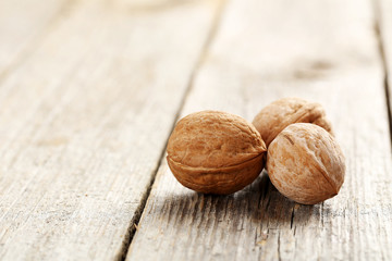 Walnut on a grey wooden table