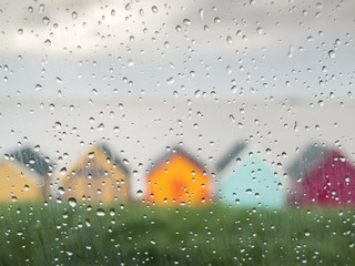 Rain drops on a car window at an English seaside town.