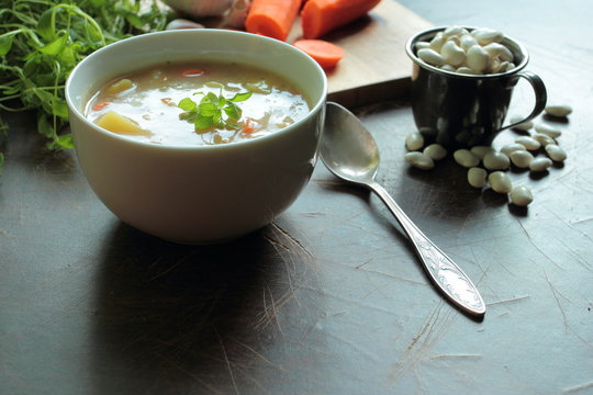 Bowl with bean soup and fresh ingredient to made hot meal